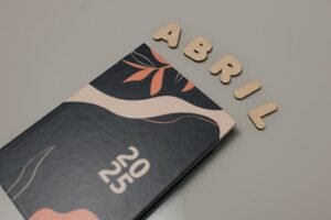 Stylish 2025 planner with 'Abril' text on a minimal tabletop.